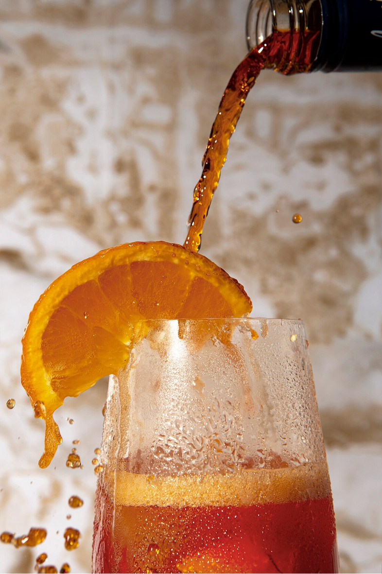 Delicious cocktail with orange slice